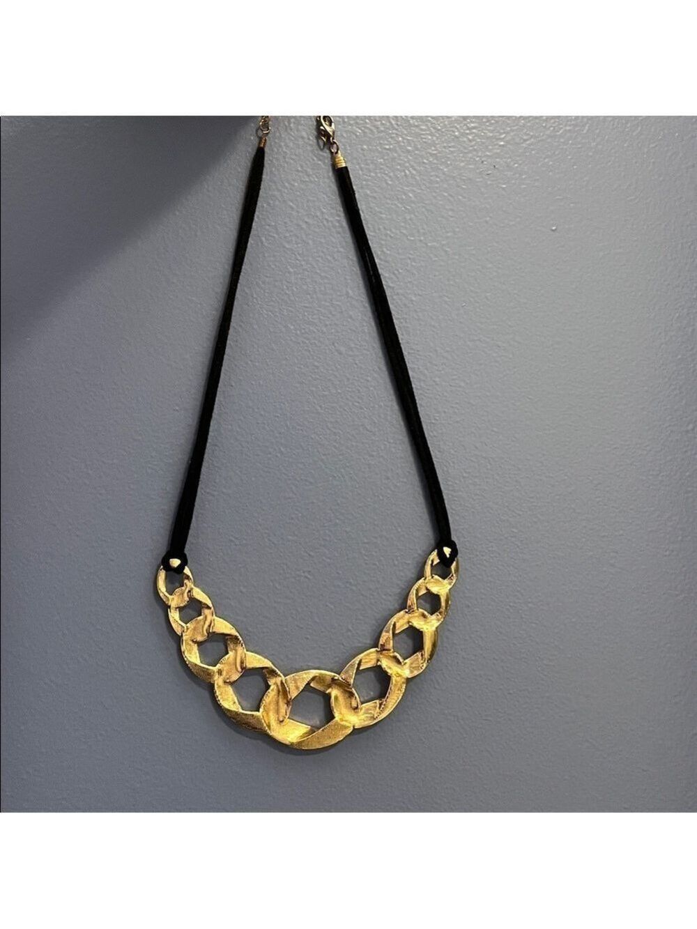 Gold tone metal and black cord Statement Necklace